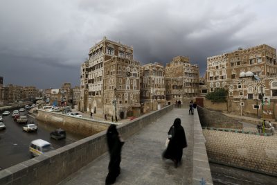 Women walk on a bridge in the old quarter of Yemen's capital Sanaa