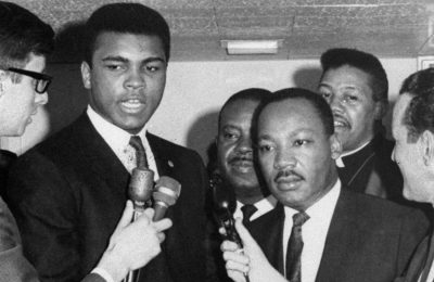 Dr. Martin Luther King Jr. and Muhammad Ali speak with reporters in Louisville. (AP Photo)